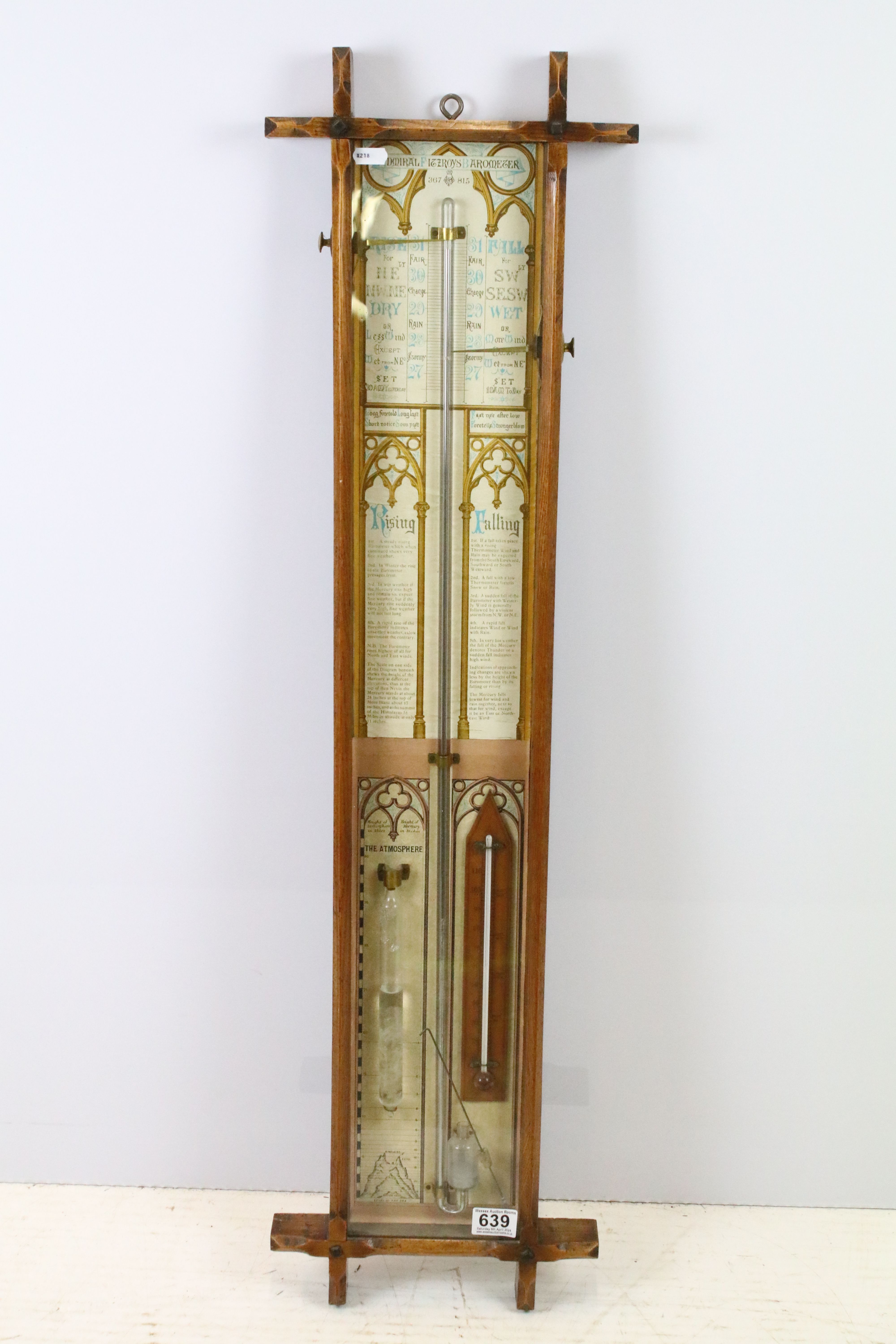 Early 20th century oak cross framed Admiral Fitzroys barometer, with paper dial, the sides with twin