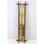 Early 20th century oak cross framed Admiral Fitzroys barometer, with paper dial, the sides with twin
