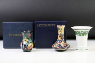 Two boxed Moorcroft pottery vases to include a Celtic Web vase (10.5cm high) and a 'Fruits'