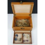 A small collection of vintage costume jewellery within a vintage jewellery box.