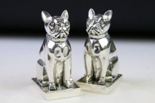 A pair of pug dog condiments stamped 800, approx 8cm tall