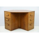 20th century oak kneehole desk, with a hexagonal top over an arrangement of six drawers, 62cm high x