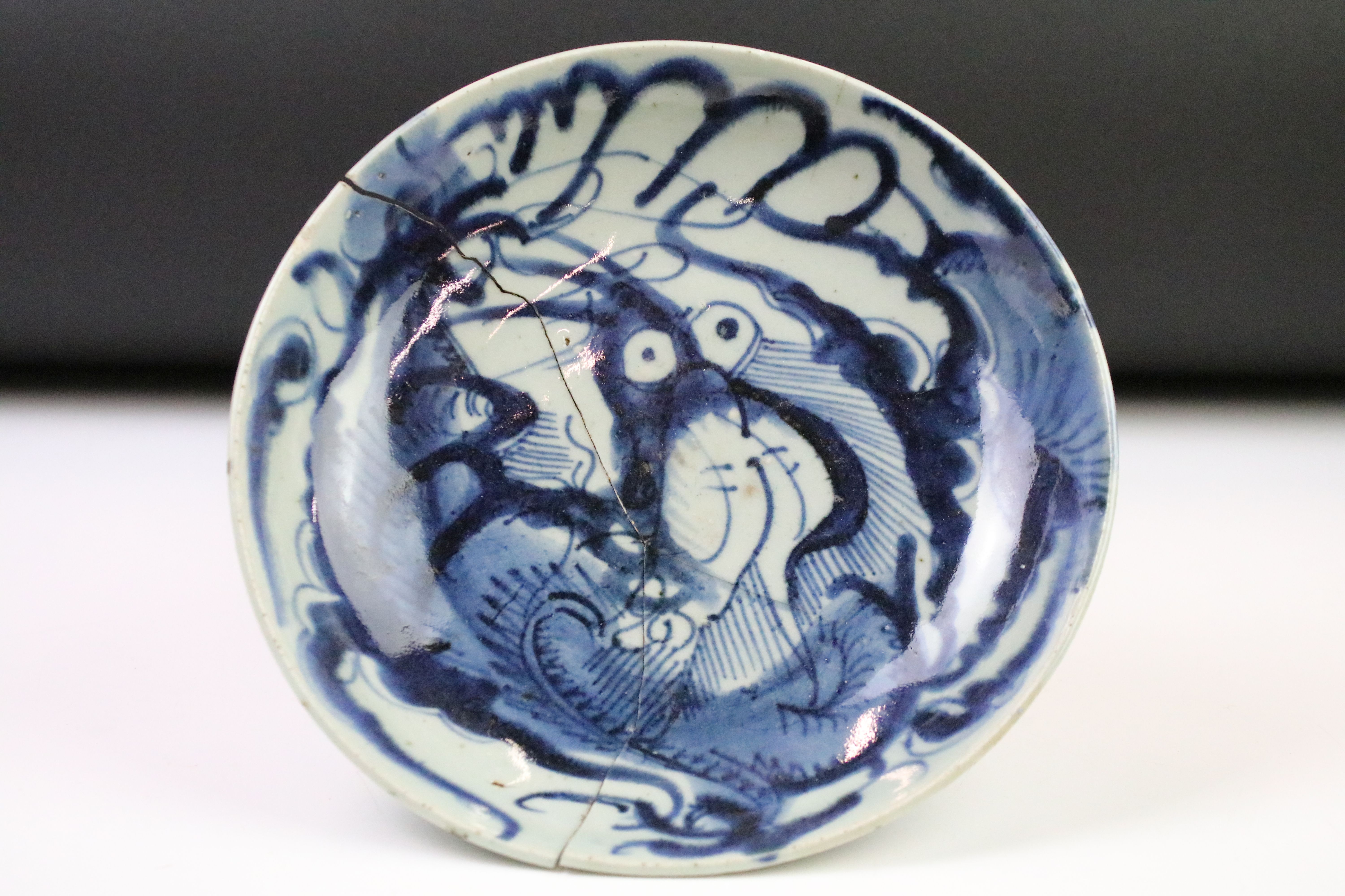 Antique Chinese Porcelain Blue and White Bowl decorated with a four claw dragon with bulging eyes in