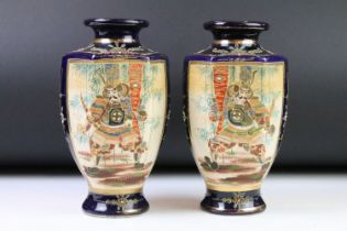 Pair of Japanese Satsuma Vases, hand painted with panels of warriors on a blue ground, red signature