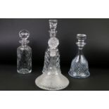 Four moulded / cut glass decanters to include a hobnail effect ships decanter, bell-shaped decanter,