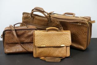 Four ostrich leather bags to include briefcase with shoulder strap, Giotto suitcase with strap,
