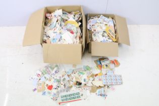 Two boxes of loose world kilo ware stamps.