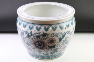 Four 20th Century Chinese fish bowl jardineres all decorated with florals and fruits with