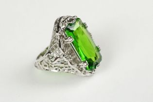 A 925 sterling silver ladies dress ring set with large green stone, filigree shoulders, marked 925