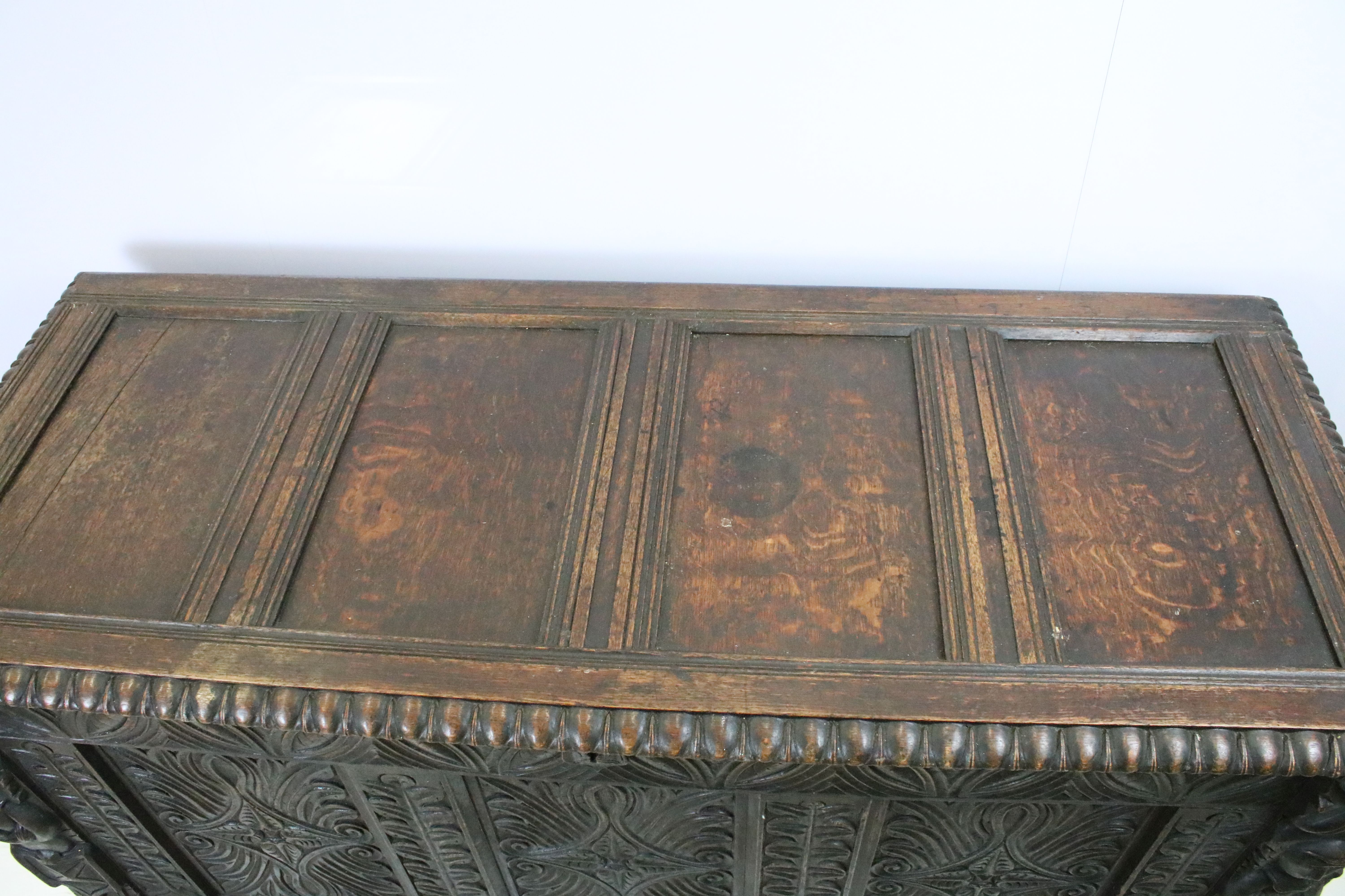 19th century carved oak chest of substantial proportions, the four panelled lid above carved - Image 5 of 7