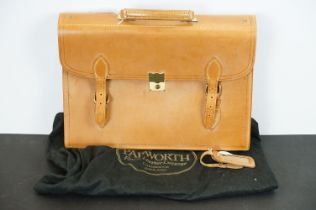 Papworth leather briefcase satchel having double buckles to front with metal lock to centre and