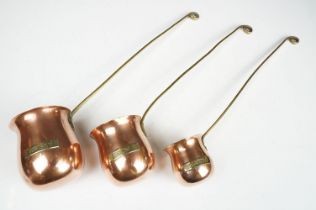 Set of Three Copper hanging graduating Spirit Measures including whisky, rum and brandy, longest
