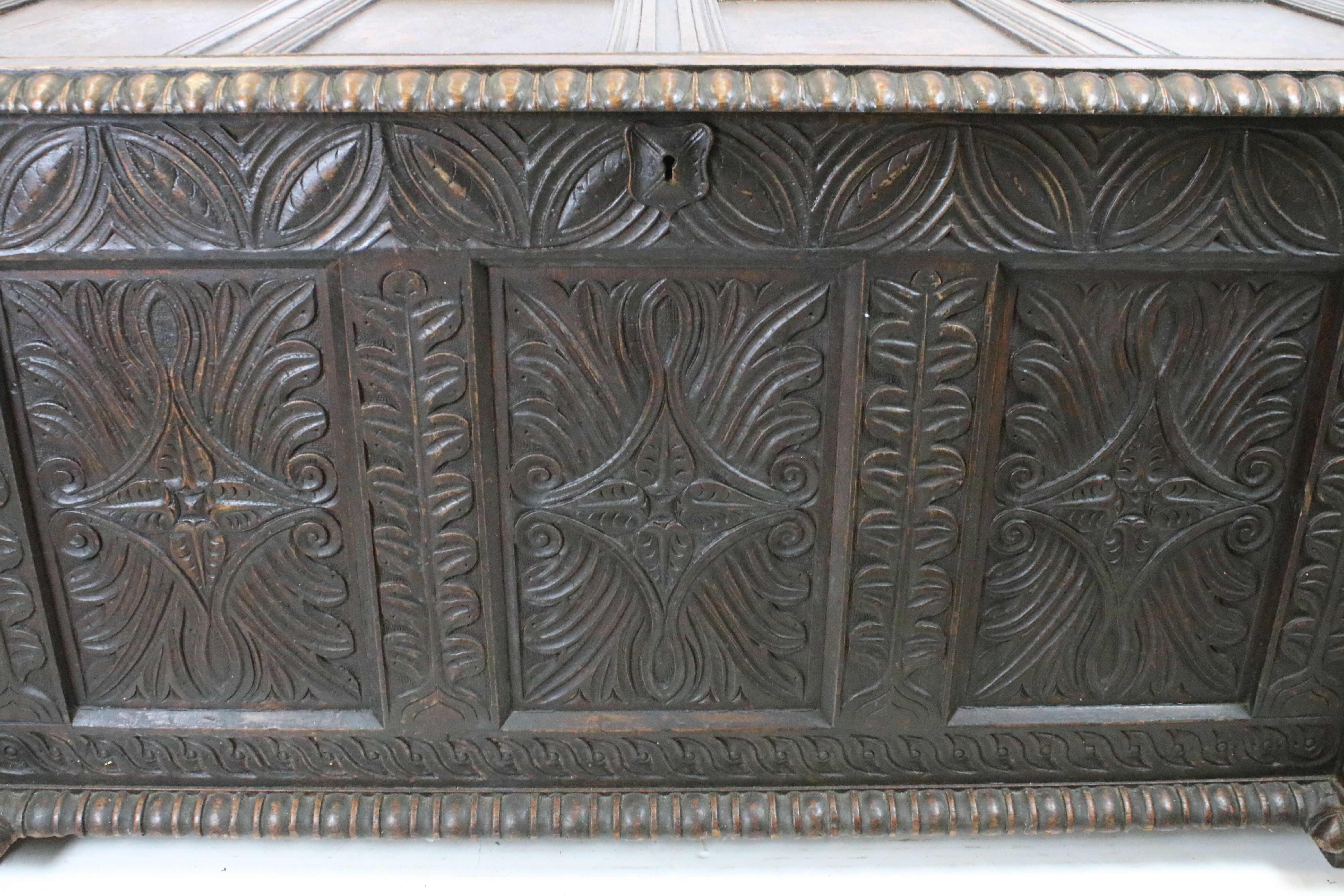 19th century carved oak chest of substantial proportions, the four panelled lid above carved - Image 7 of 7