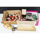 A small collection of vintage costume jewellery to include beaded necklaces, pendants, brooches....