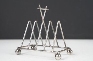 In the manner of Christopher Dresser, a 19th century Silver Plated four section Toast Rack, approx