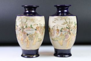 Pair of Japanese Satsuma Vases, Meiji period, painted with panels of Geishas in a garden on a blue