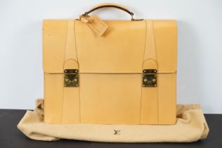 Louis Vuitton - Tanned leather briefcase with gold hardware and two compartments within. Measures 34