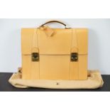 Louis Vuitton - Tanned leather briefcase with gold hardware and two compartments within. Measures 34