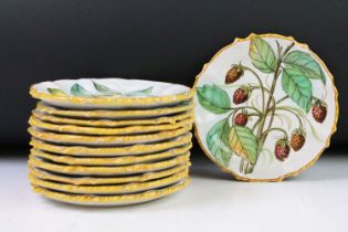 Set of 12 Italian faience plates with hand painted fruit decoration and yellow borders, approx