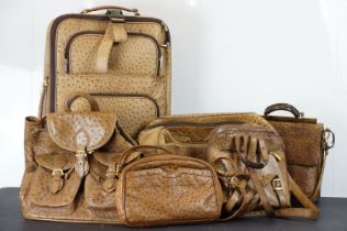 Collection of ostrich leather bags to include a small wheeled suitcase, two ruck sacks, shoulder