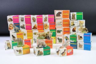 Collection of around 40 boxed Wade porcelain miniatures to include Wade Whimsies and Wade Whoppas