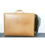 Hartmann leather suitcase with metal combination lock and handle to top. Suitcase measures 64 x 50 x