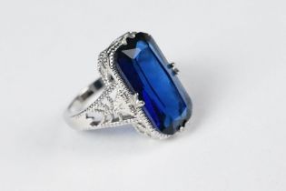 A 925 sterling silver ladies dress ring set with large blue stone, filigree shoulders, marked 925