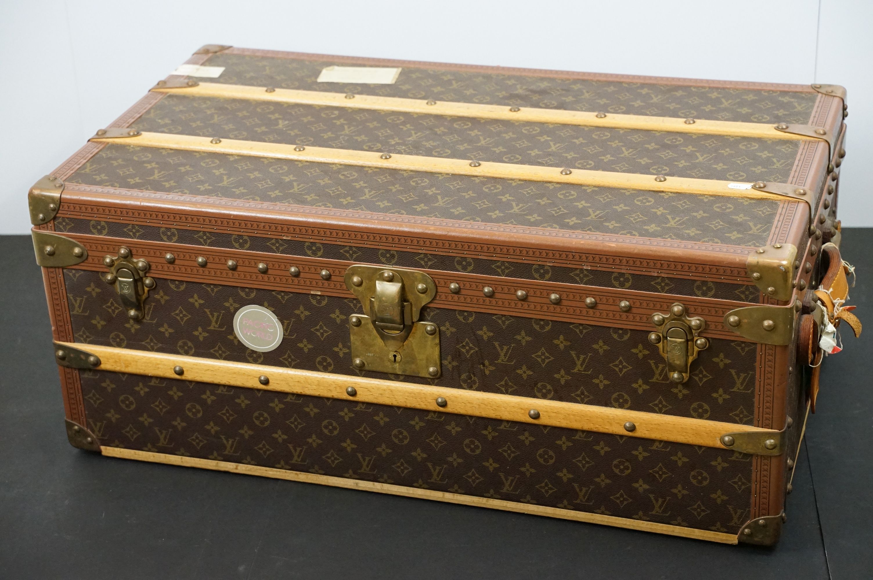 Louis Vuitton - Monogrammed canvas travel trunk having branded leather banding, wooden slats,