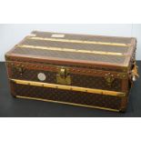 Louis Vuitton - Monogrammed canvas travel trunk having branded leather banding, wooden slats,