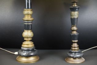 Two black marble table lamps with brass mounts, the tallest 65cm high