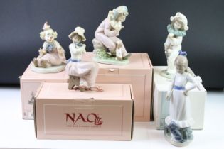 Group of thirteen assorted Nao figurines, eleven being boxed. The lot to include clowns, and