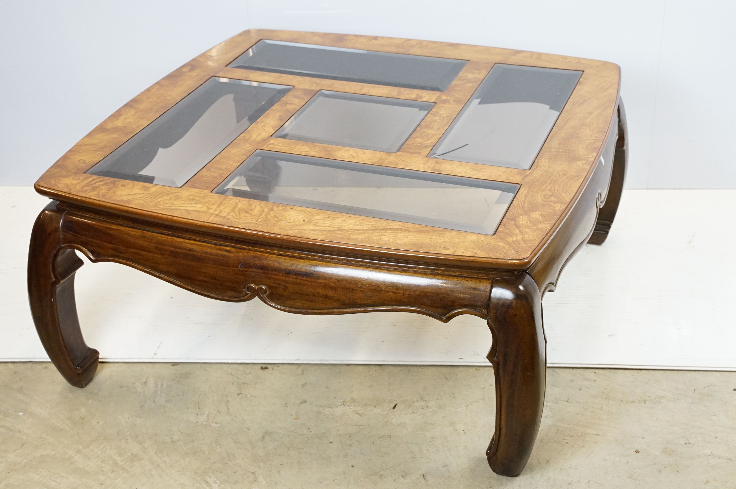 Walnut coffee table, in the Oriental style, with five bevelled glass panels, 44cm high x 96.5cm wide