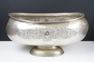 Large early 20th century silver plated planter of oblong form, with repousse scrolling foliate