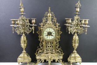 Cast brass clock garniture set clock of scrolling form, the clock with pierced design, cream dial