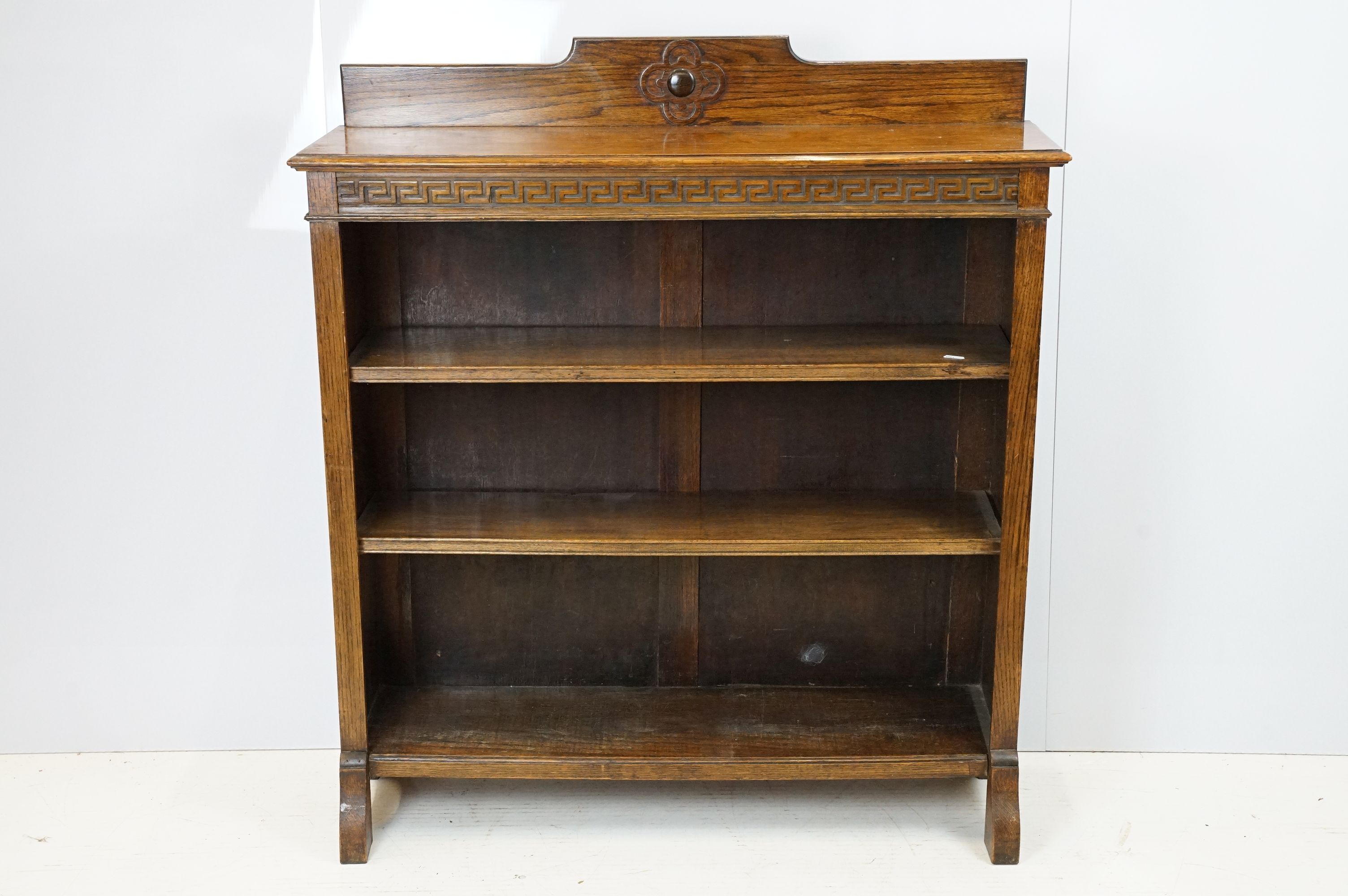 Oak three shelf bookcase with Greek key frieze design, 102cm high x 92cm wide x 26cm deep