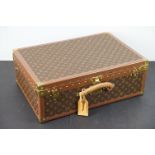 Louis Vuitton - Monogrammed canvas trunk with brass fittings and lock, opening to reveal beige