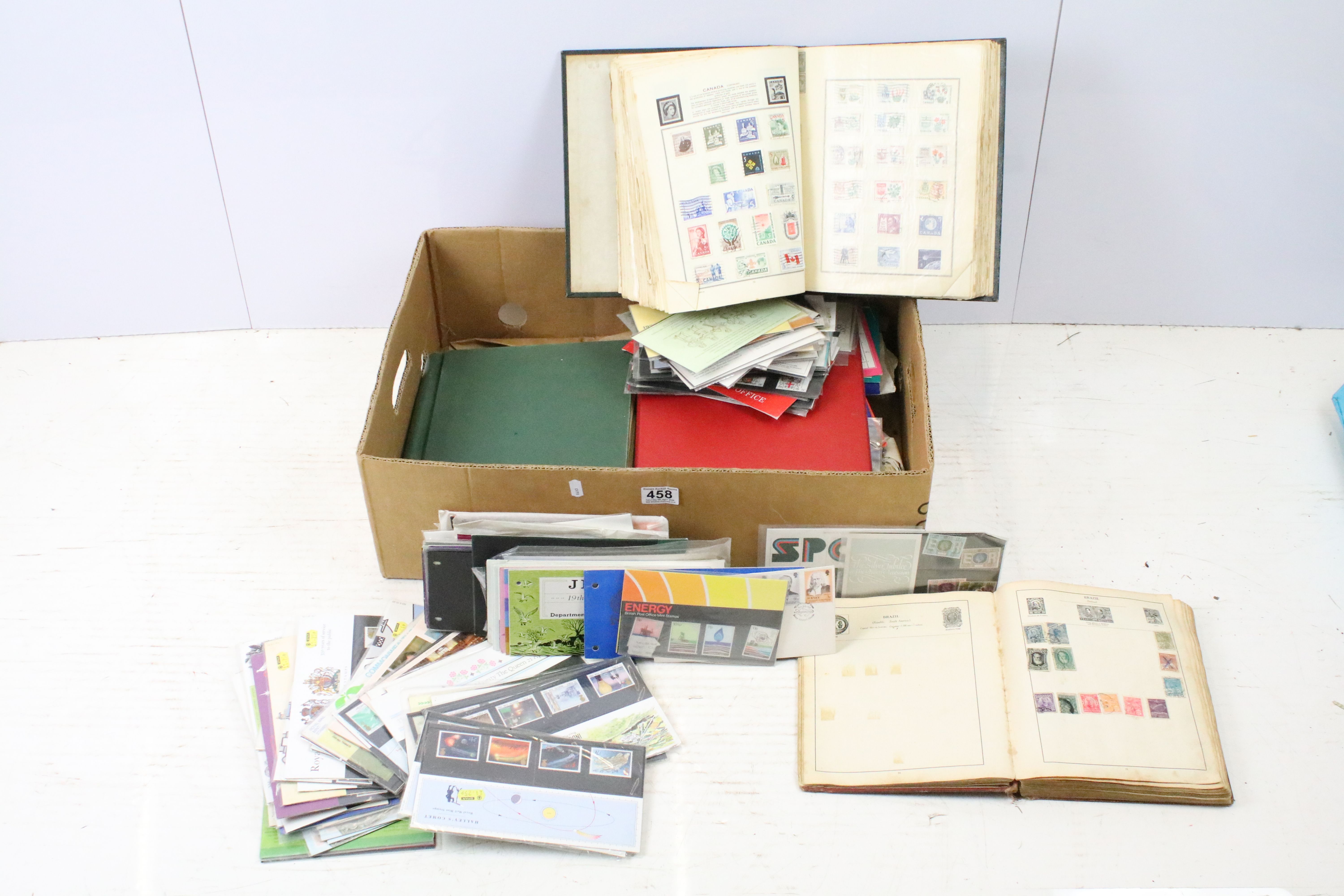 Approximately 100 loose late 20th Century presentation pack stamps, together with an album of