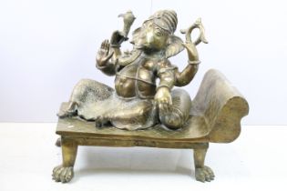 Indian brass figure of Ganesh reclining, 68cm long x 55cm high