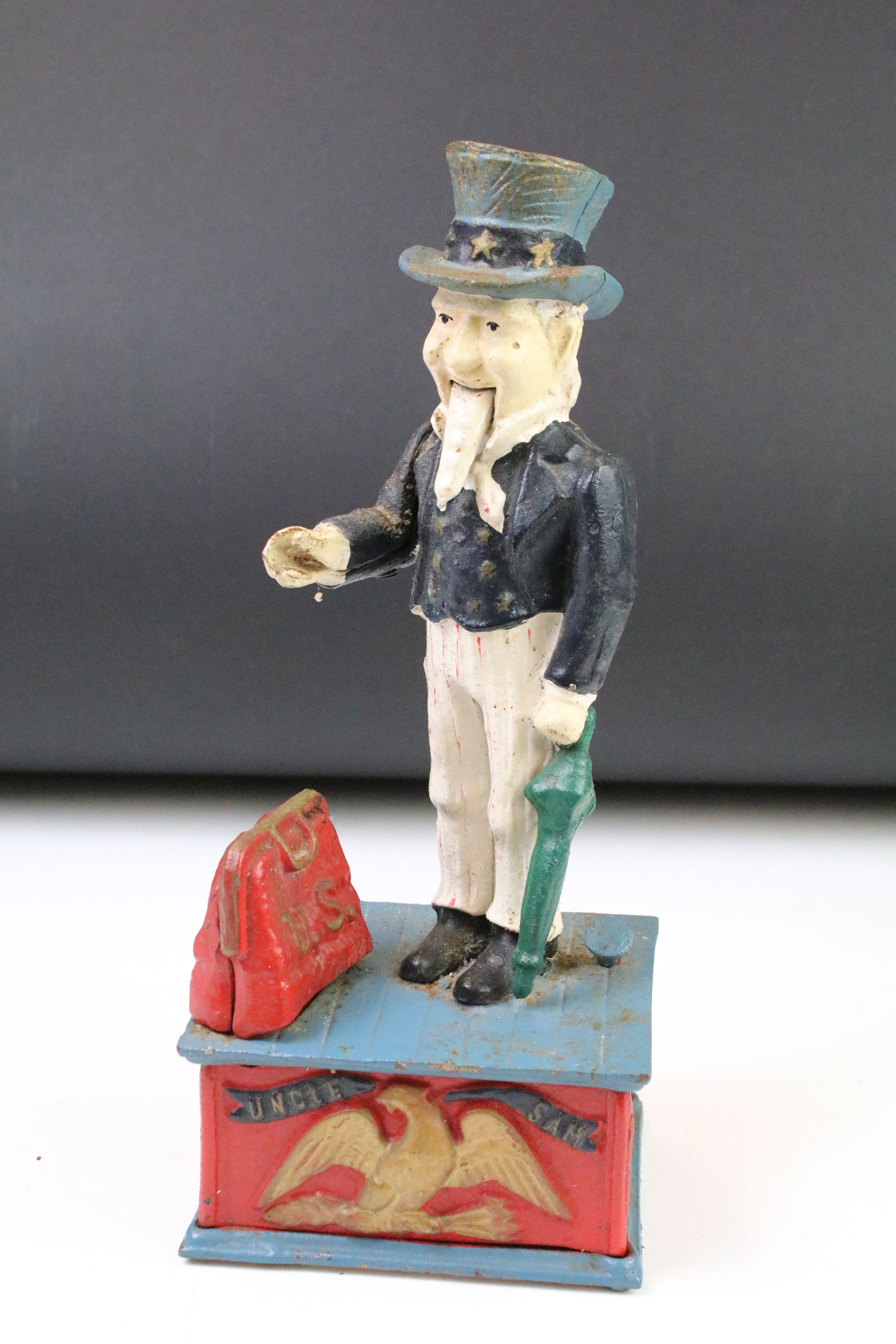 Two reproduction cast iron money boxes to include a Punch and Judy box and an Uncle Sam example. - Image 2 of 5