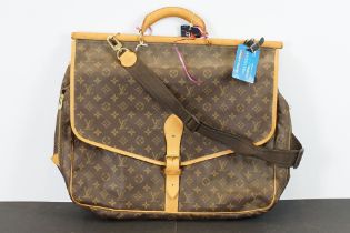 Louis Vuitton - Sac Chasse hunting bag having a monogrammed body with tan leather straps and gold