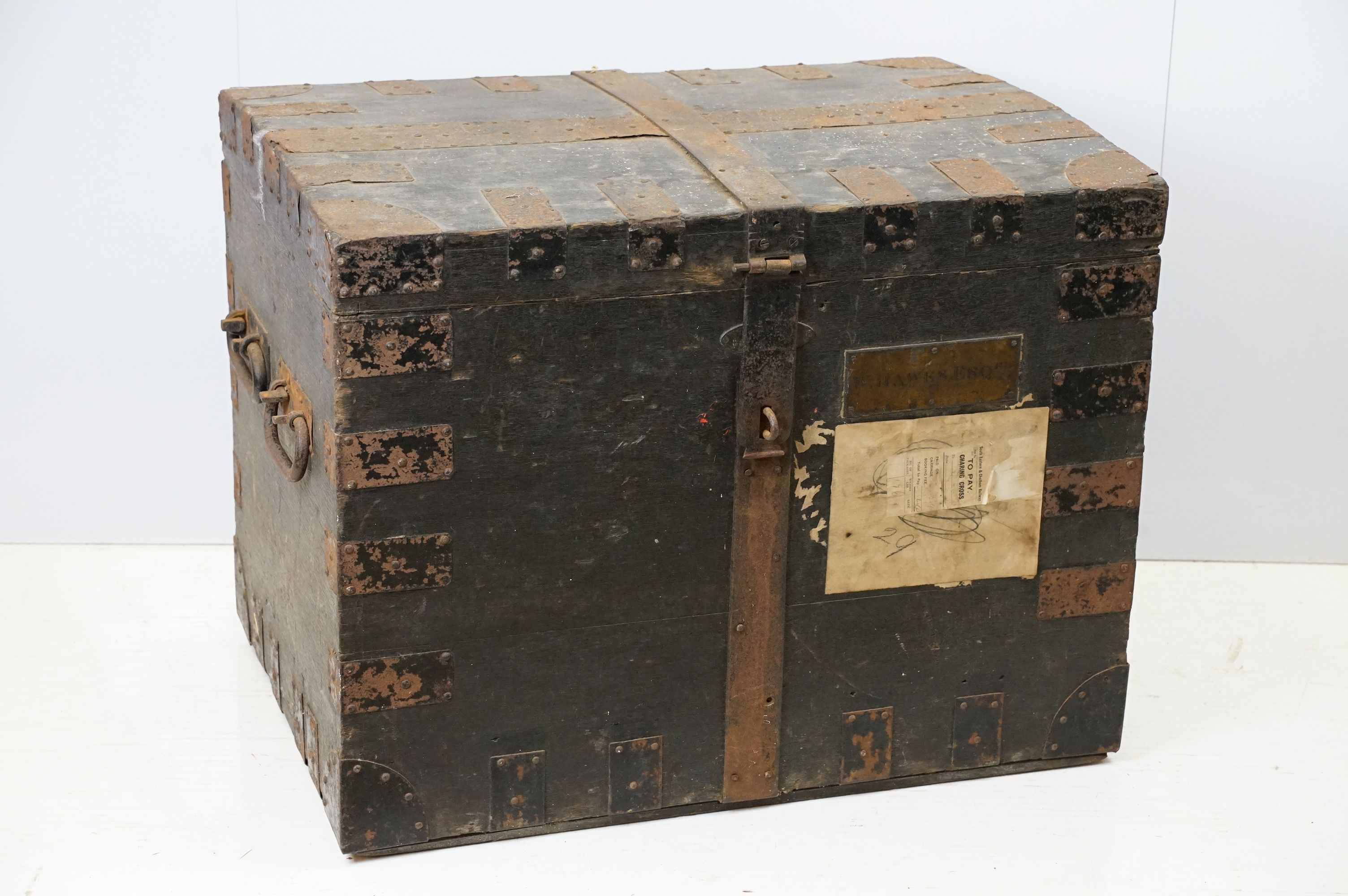 Early 20th century oak and metal mounted travelling trunk, with two handles to each side, brass