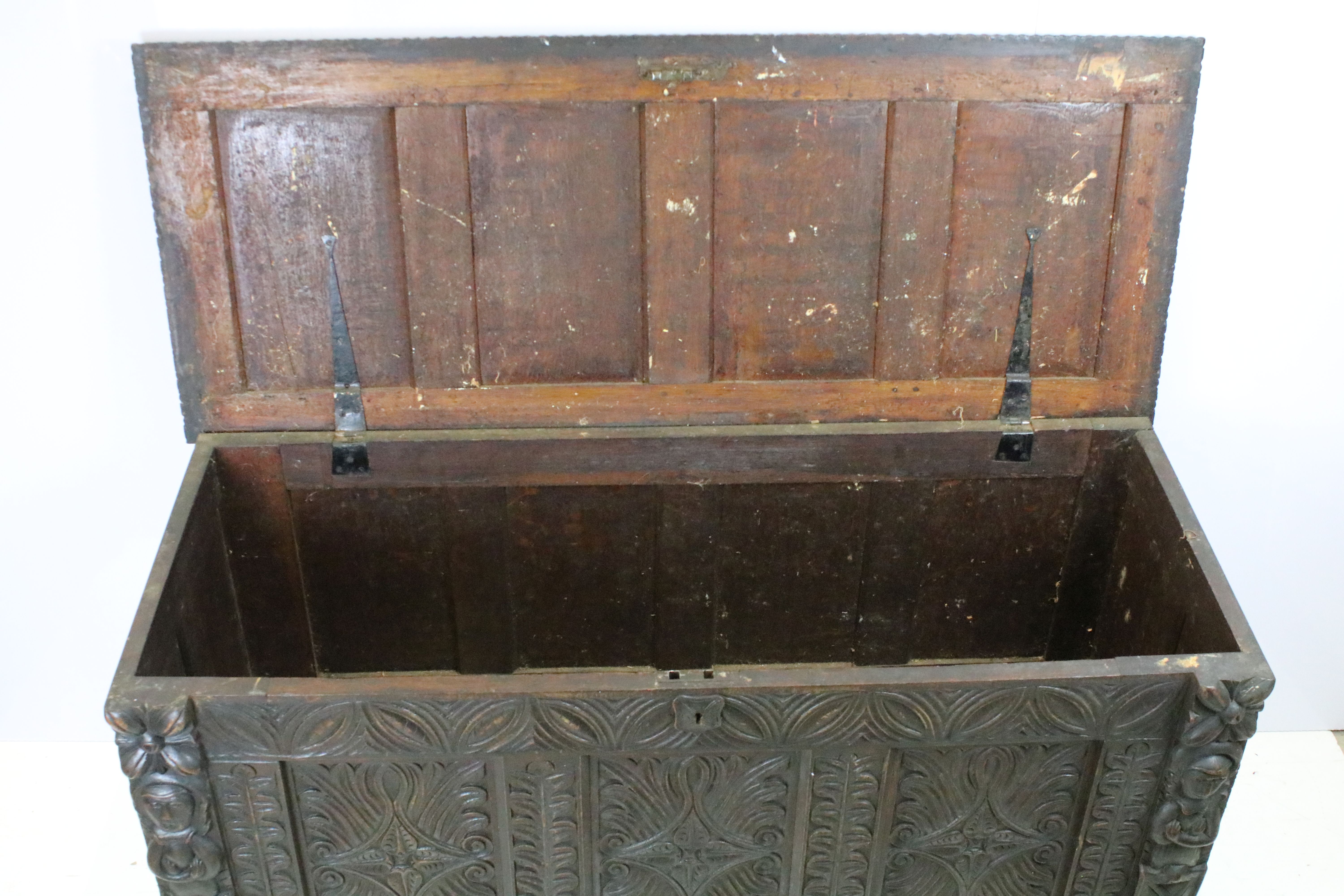 19th century carved oak chest of substantial proportions, the four panelled lid above carved - Image 2 of 7