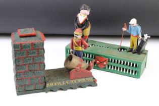 Two reproduction cast iron money boxes to include one Artillery Bank example, and one novelty