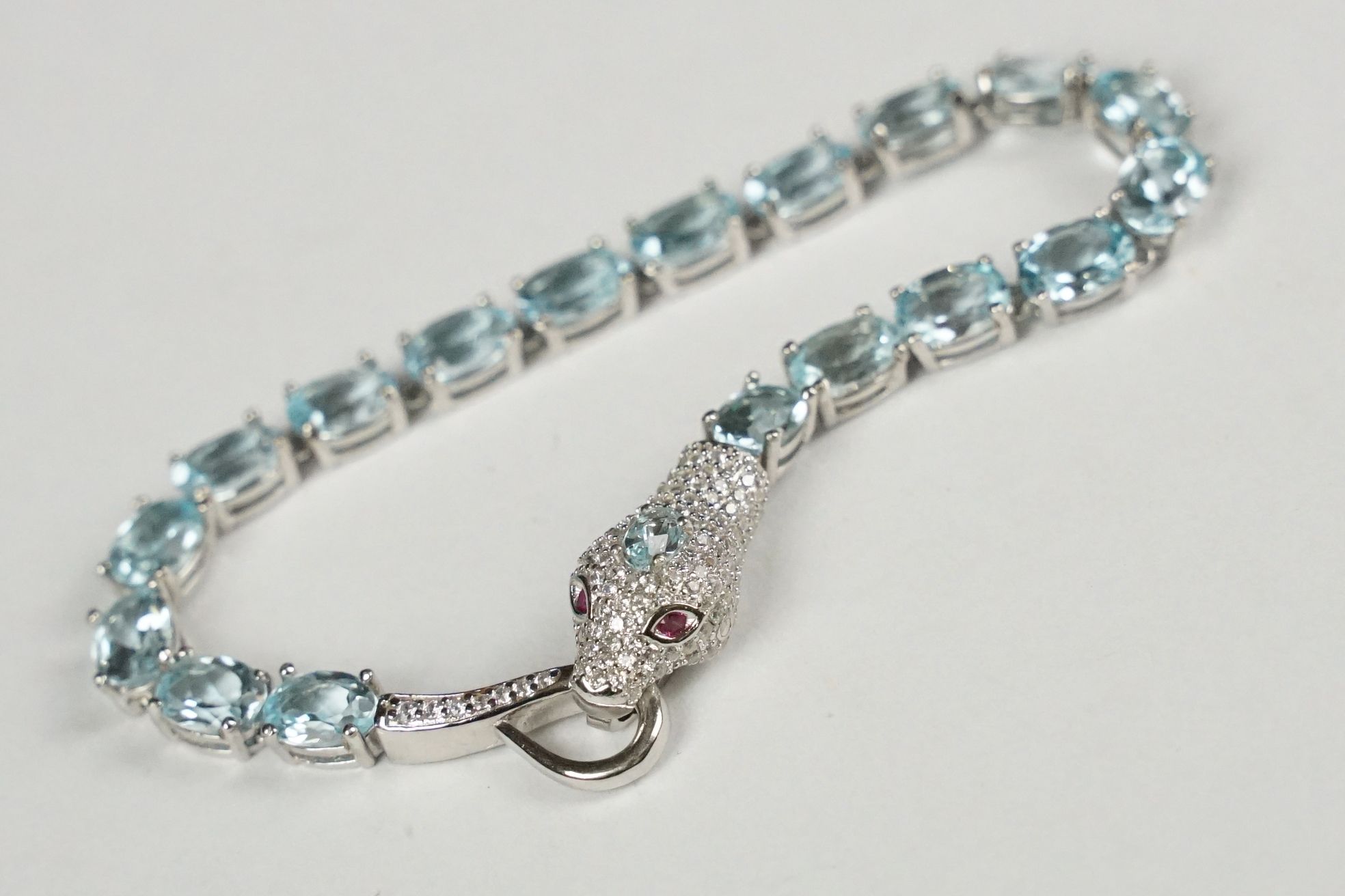 Silver and aquamarine bracelet with snake head clasp