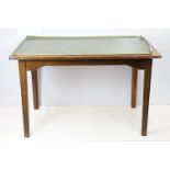 Mid century mahogany table with green leatherette inset top, on square tapering legs, marked