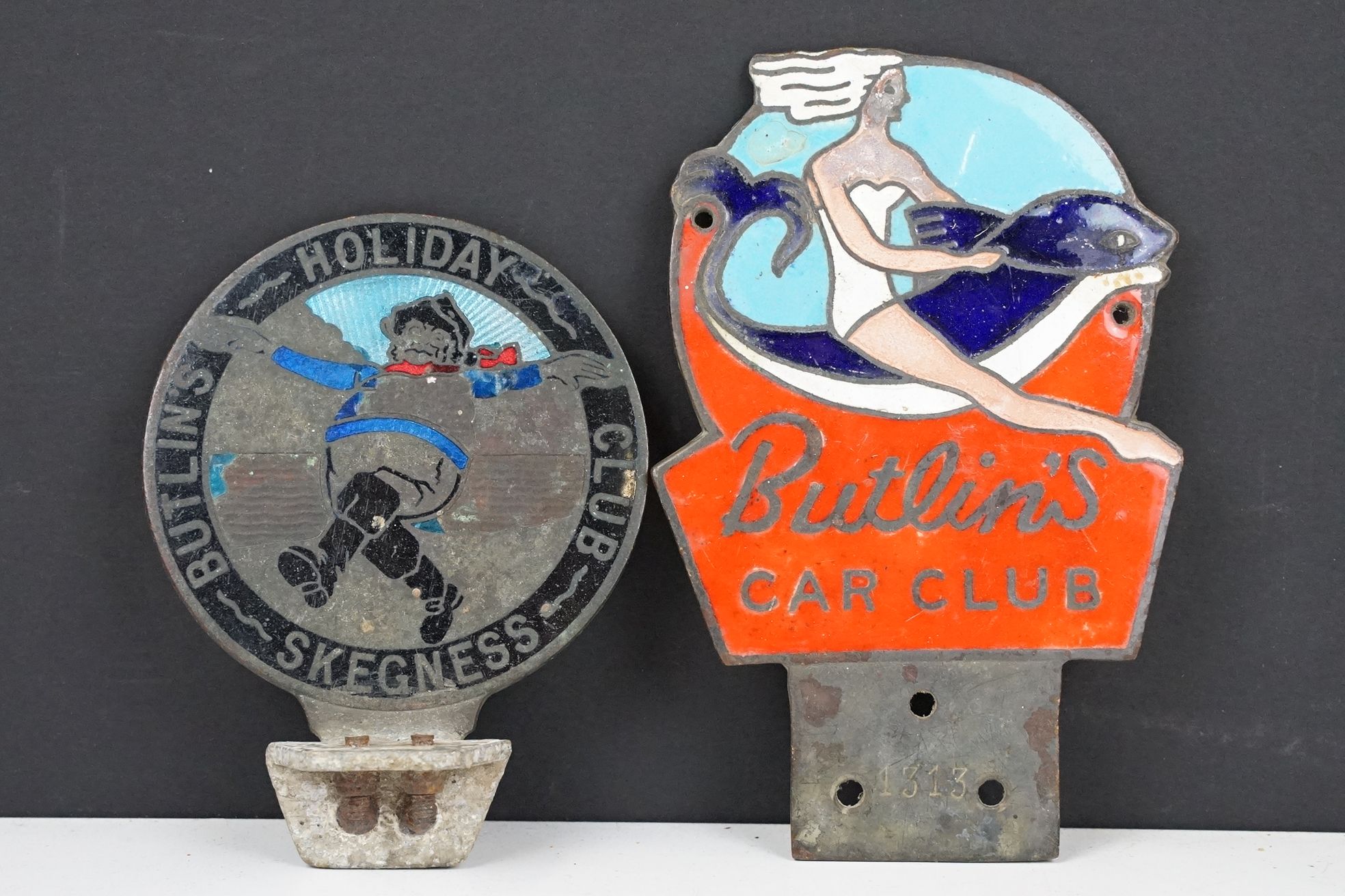 Two vintage Butlin's enamelled car badges to include Butlin's Car club (approx 14.5cm long) and