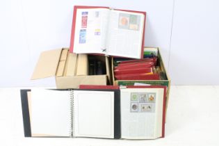 Two boxes of empty stamp albums, together with a selection of international stamp encyclopaedia's in