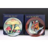 Two boxed Moorcroft pottery pin dishes to include Toadstools & Red Tulip examples. (Measure approx