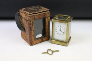 Late 19th / early 20th century brass cased carriage clock with bevelled glass panels, with key,