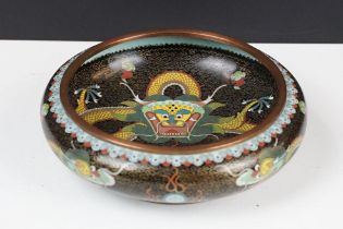 Chinese cloisonne enamel circular dish decorated with dragons on a black ground, character marks
